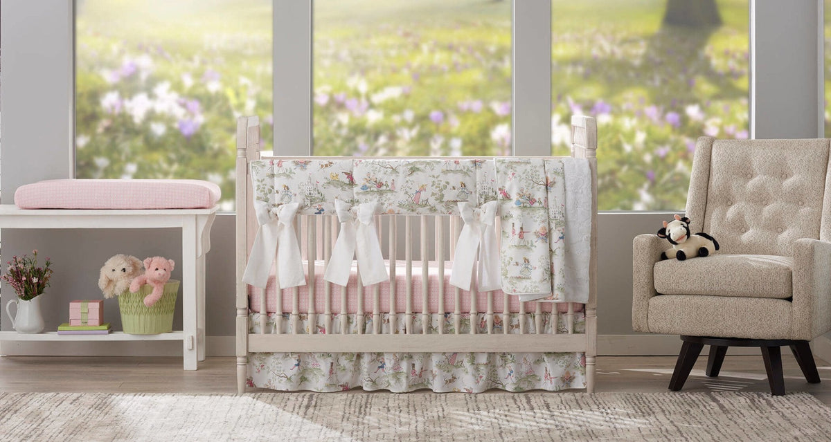 Nursery with a crib dressed in Liz and Roo Nursery Rhyme Toile bedding beside a window