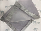 grey faux fur and satin blanket